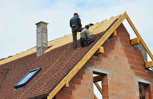 Mens Working On Top Roof